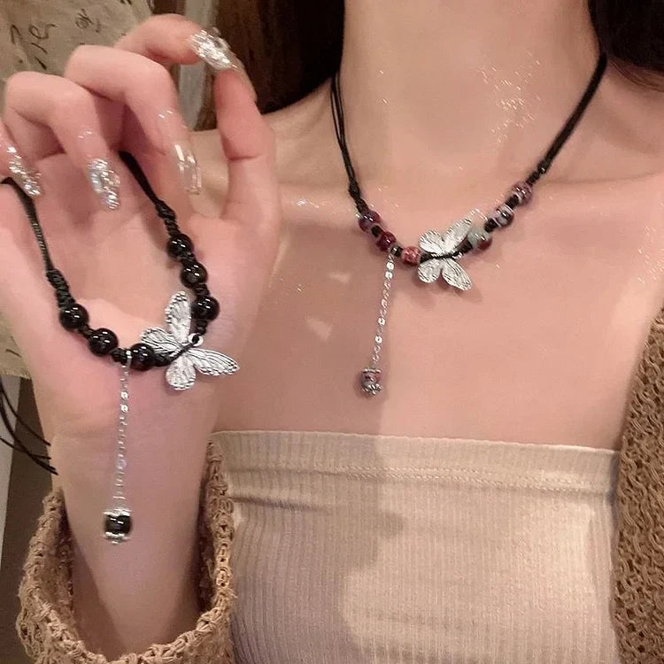 Womens elegant butterfly necklace with a single pearl. A delicate & versatile jewelry piece, perfect for gifting.