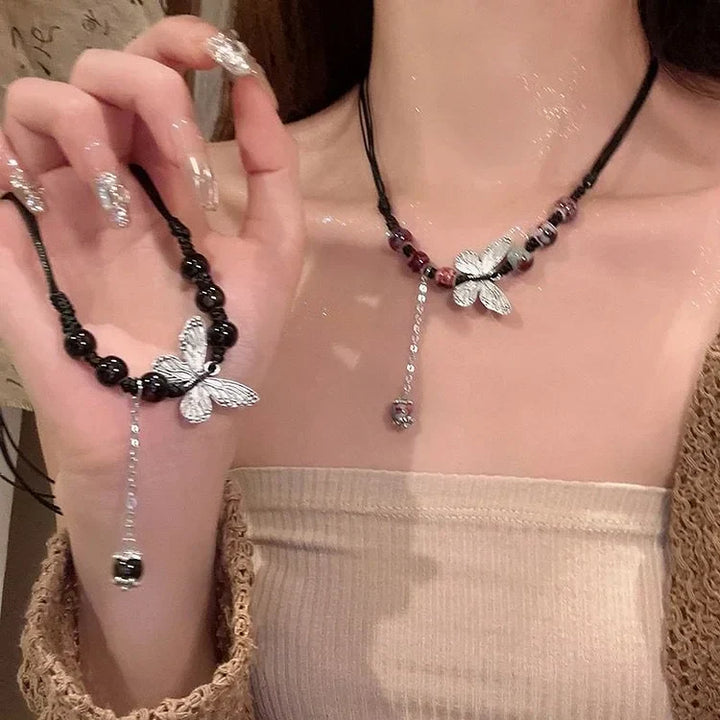 Womens elegant butterfly necklace with a single pearl. A delicate & versatile jewelry piece, perfect for gifting.