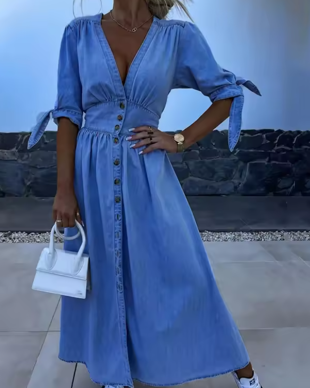 Elegant women's button-down A-line dress, perfect for versatile summer style. Comfortable & flattering short-sleeve design.
