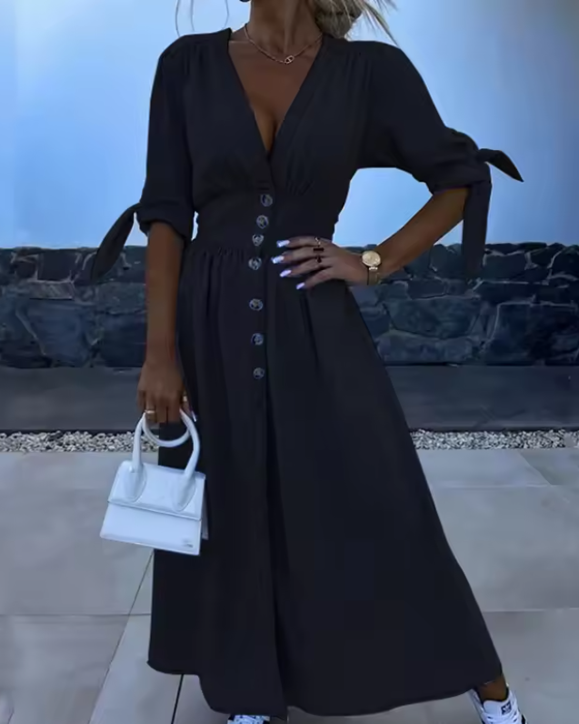 Classic women's A-line dress with elegant button-down detail. Soft, comfortable fabric for everyday casual summer wear.