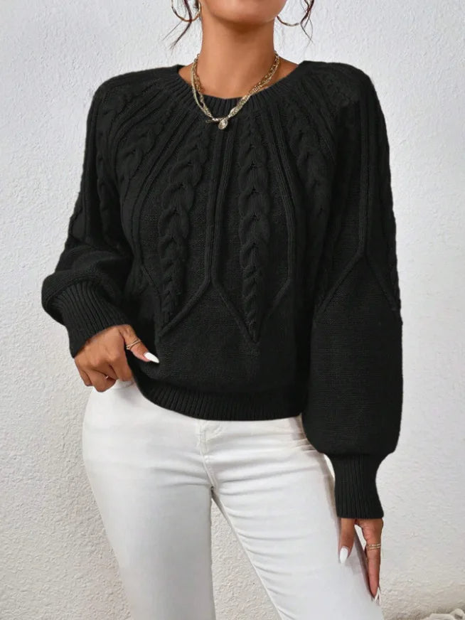 Beautiful women's cable knit sweater with elegant balloon sleeves and ribbed cuffs, a winter essential.