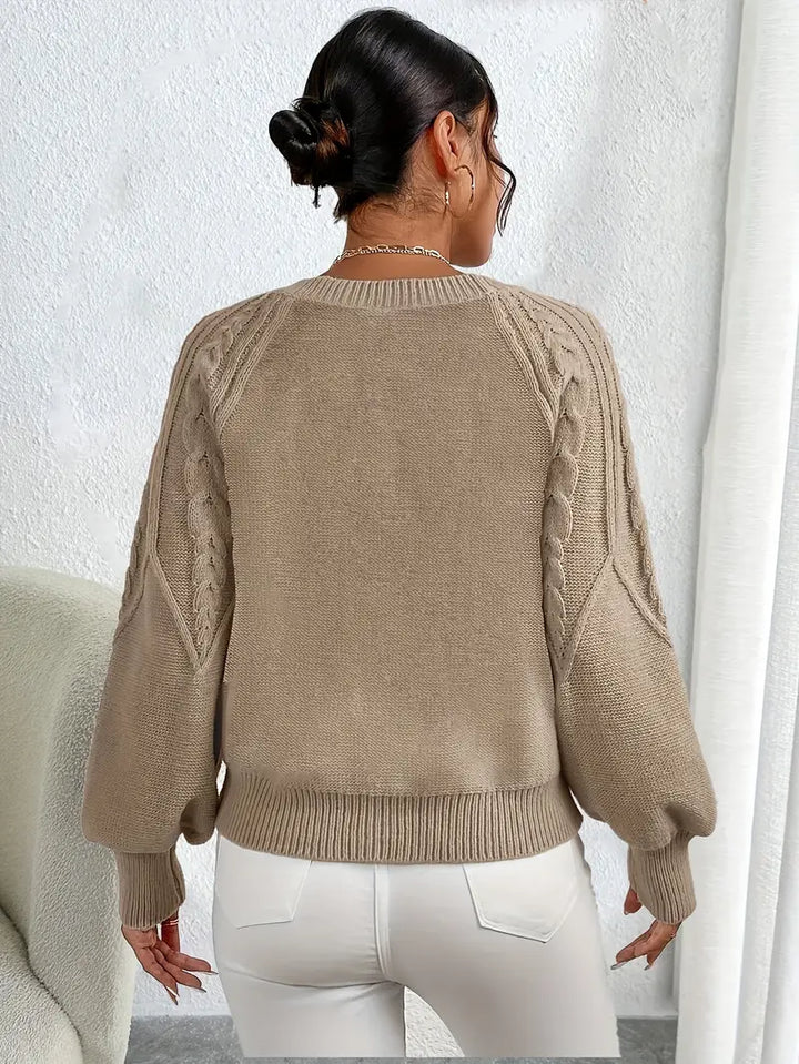 Cozy women's cable knit top, a versatile sweater with elegant balloon sleeves for winter style.