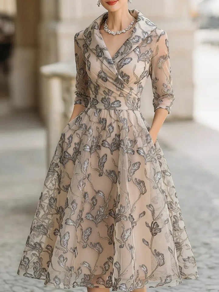 Elegant women's champagne short sleeve midi dress with graceful leaf embroidery, perfect for an occasion.