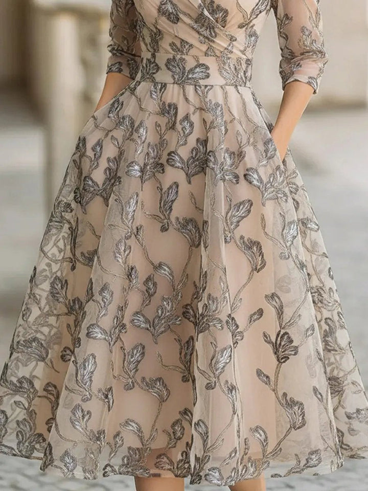 Graceful champagne short sleeve midi dress for women, featuring elegant leaf embroidery and a timeless silhouette.