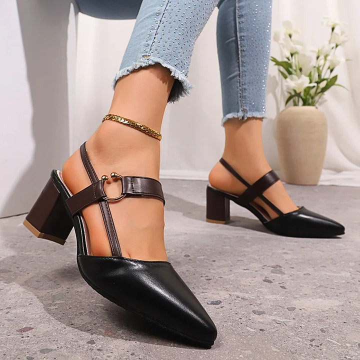 Women's chic brown slip-on block heels, elegant footwear with a modern gold ring detail. Day to evening.