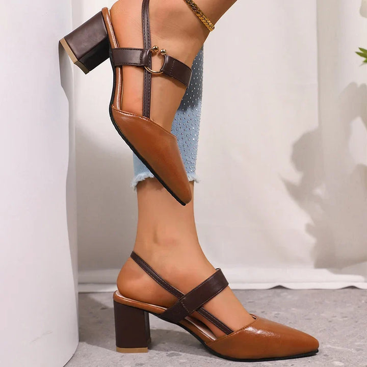 Sophisticated black women's block heels, chic ring design for versatile day to evening elegance. Slip-on style.