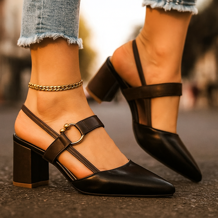 Black women's elegant block heels, chic slip-on style with a distinctive gold ring detail. Fashion footwear.