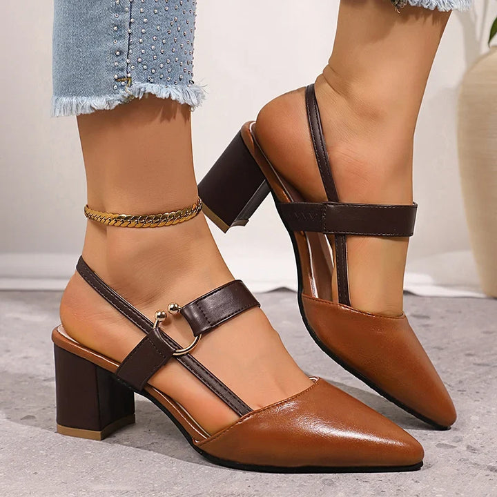 Beige women's elegant block heels, chic slip-on design with a distinctive gold ring. Versatile footwear.
