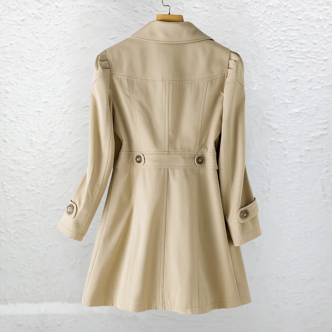 High-quality women's belted trench coat with a structured silhouette, embodying classic elegance & durability.