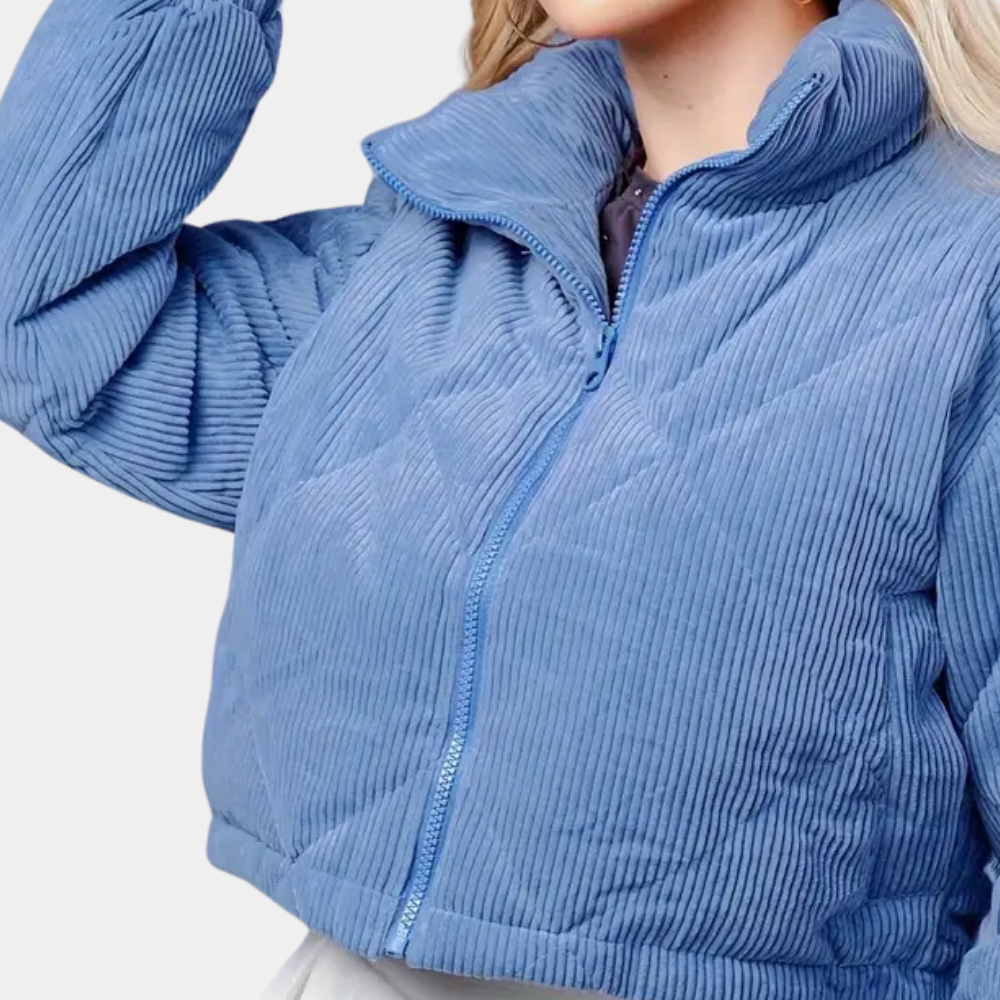 Elegant women's classic blue winter coat, offering warm protection for cold days. Essential women's outerwear.