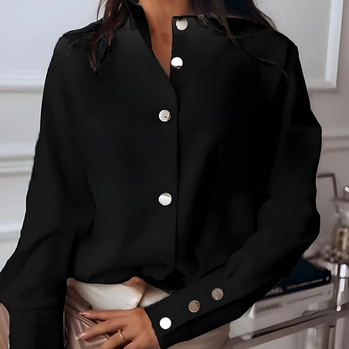 Fashionable women's classic button-down shirt. Everyday style long-sleeve top with collar for versatile office wear.