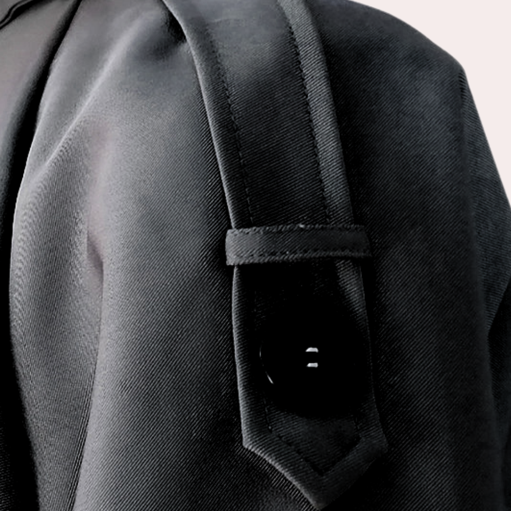 Side profile of a women's classic trench coat, highlighting its long silhouette and autumn fashion appeal