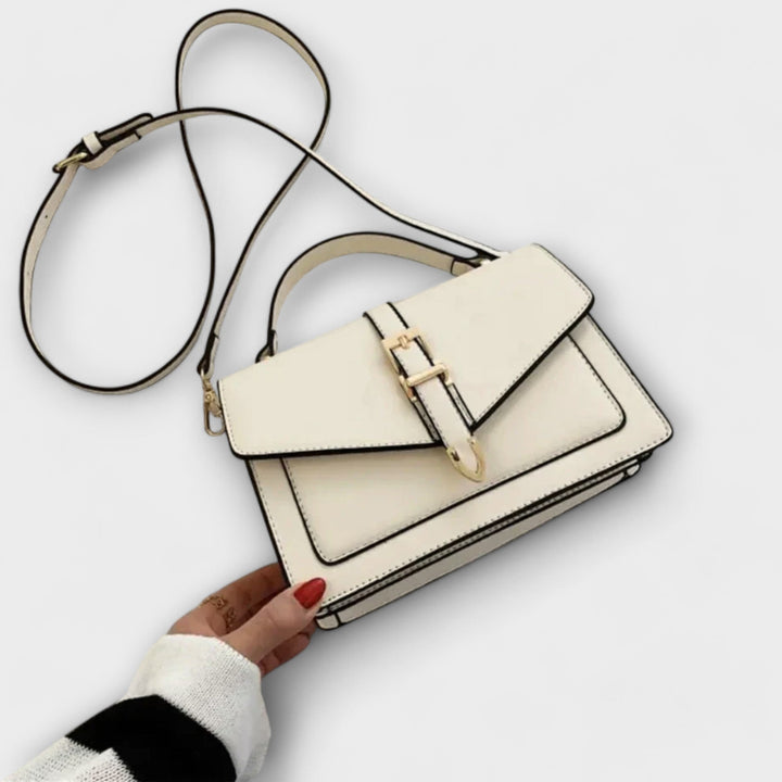 Classic and elegant women's flap shoulder bag, a chic everyday fashion accessory.