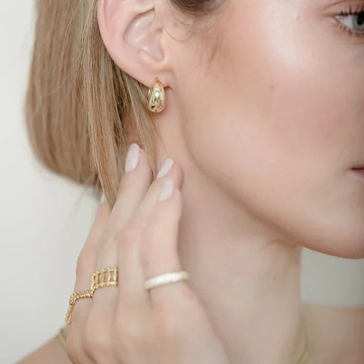 Elegant women's classic gold drop earrings. Perfect for any occasion. Versatile and timeless plated jewelry.