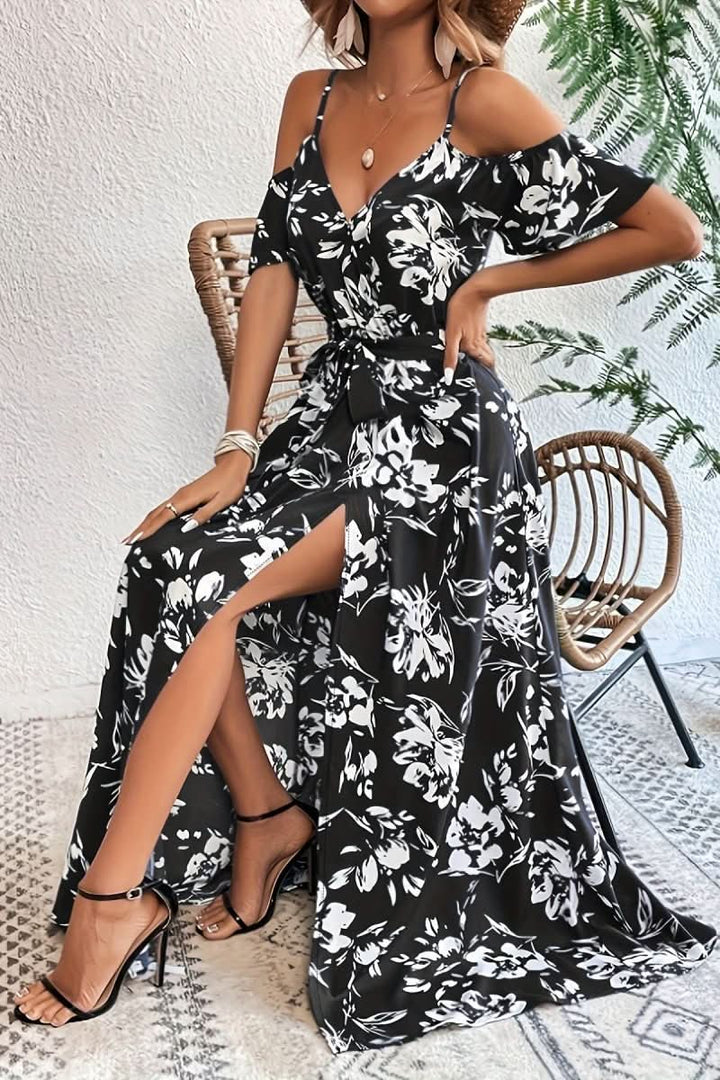 Romantic cold shoulder maxi dress. Women's elegant evening gown with a flowing silhouette for a refined look.