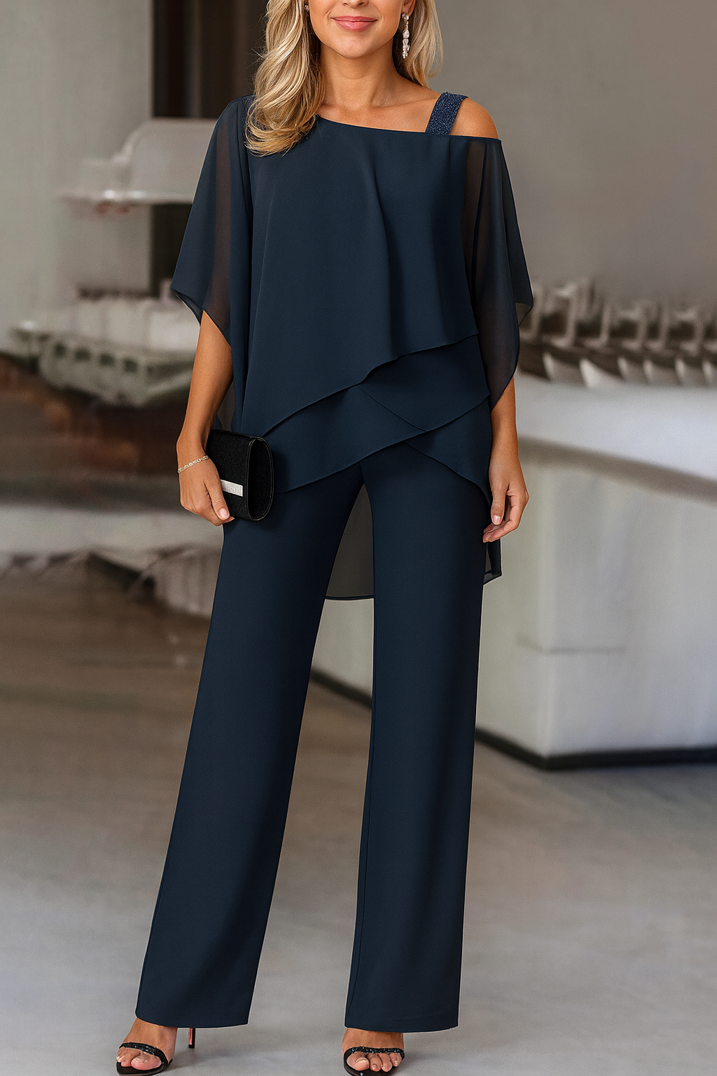 Women's elegant cold-shoulder two-piece pants set in blue. Chic and comfortable for any special occasion.