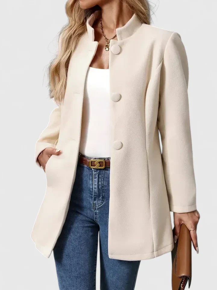 Chic collarless women's jacket with button closure, a lightweight and versatile outerwear for elegant style.