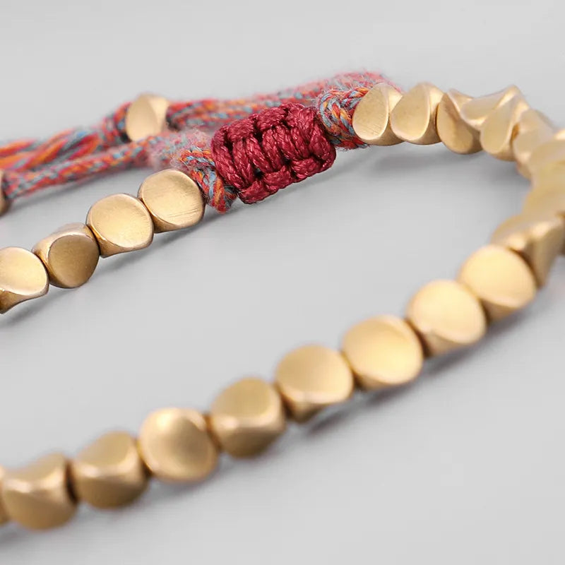 Polished copper bead lucky bracelet for women. Elegant accessory promoting positive energy.