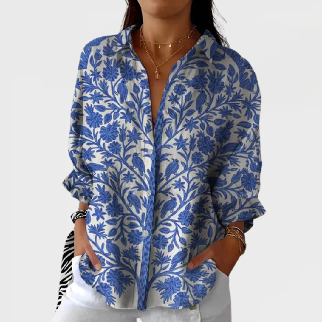 Elegant women's cream blouse with blue floral garden print. Versatile long sleeve top for spring & summer.