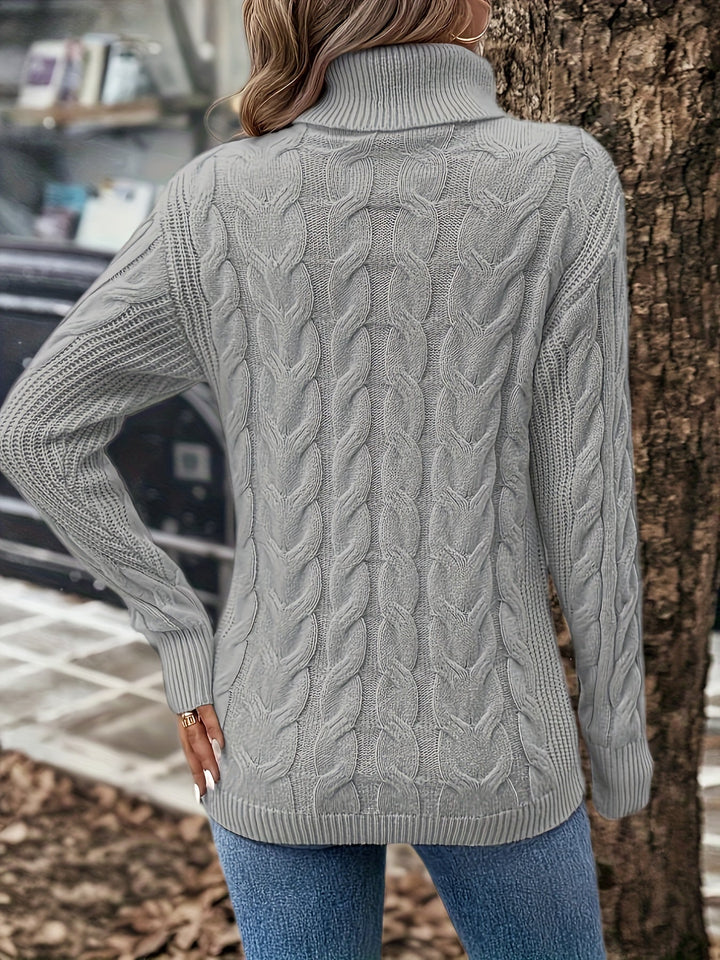 Elegant women's cable knit turtleneck sweater. Versatile and cozy for chic everyday winter wear.