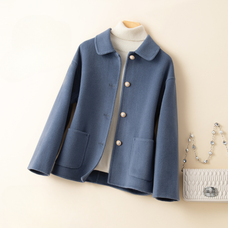 Stylish women's cropped outerwear, an elegant and versatile layer with a cute doll collar for fall.