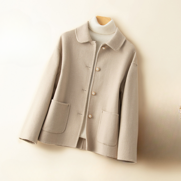 Sophisticated women's cropped jacket, a chic fall fashion piece with an elegant doll collar design.