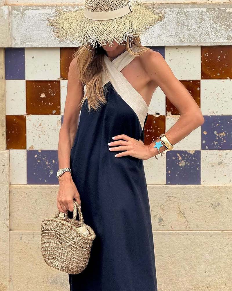 Flowy women's cross-neck summer dress, designed for comfort and elegant vacation style.