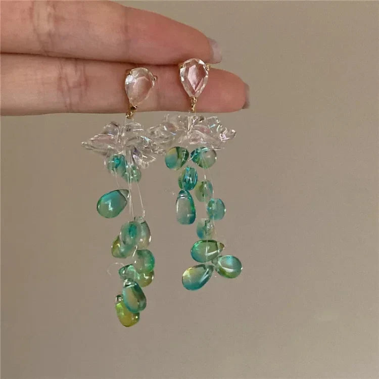 Sophia women's elegant crystal flower tassel earrings. Sparkling delicate jewelry for a sophisticated look.