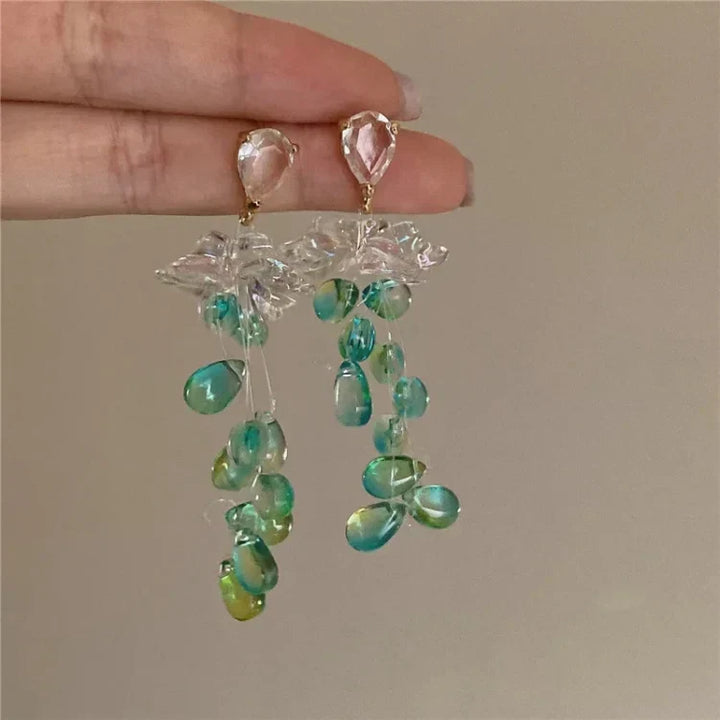 Sophia women's elegant crystal flower tassel earrings. Sparkling delicate jewelry for a sophisticated look.