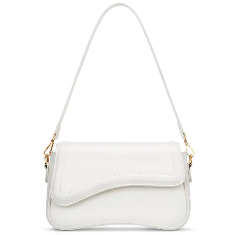Minimalist women's shoulder bag featuring a stylish curved flap. Elegant vegan leather handbag.