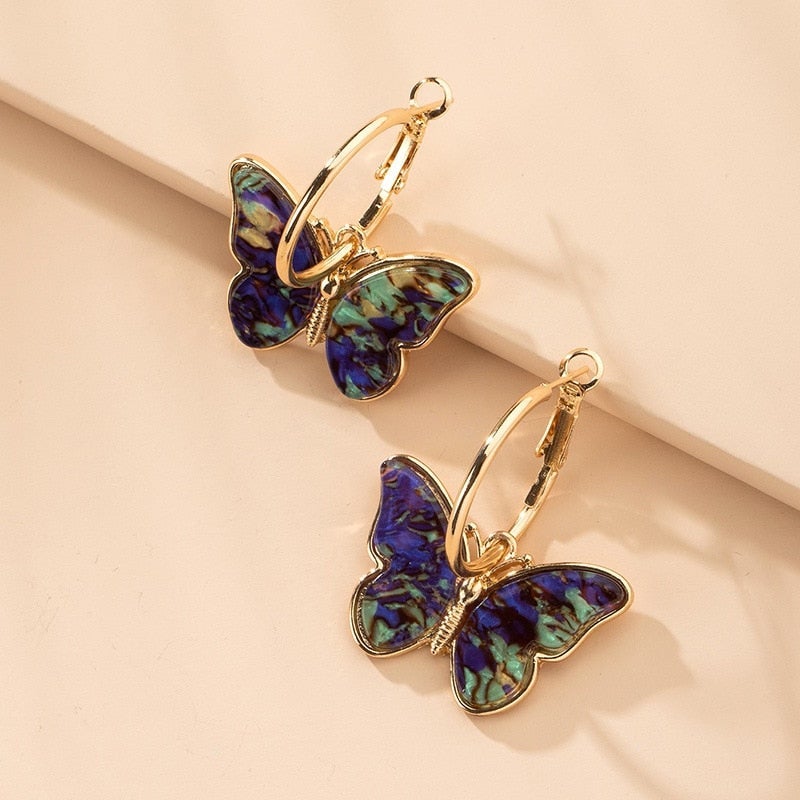 Women's nature-inspired butterfly drop earrings, featuring delicate design & sparkling crystals, perfect elegant fashion jewelry.