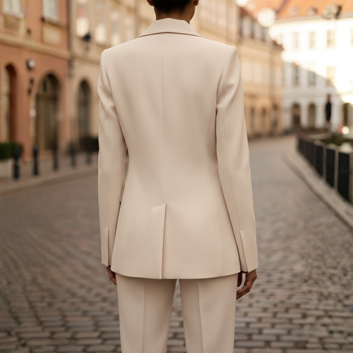 Professional women's tailored suit: double-breasted blazer & straight leg trousers for sophisticated office fashion.