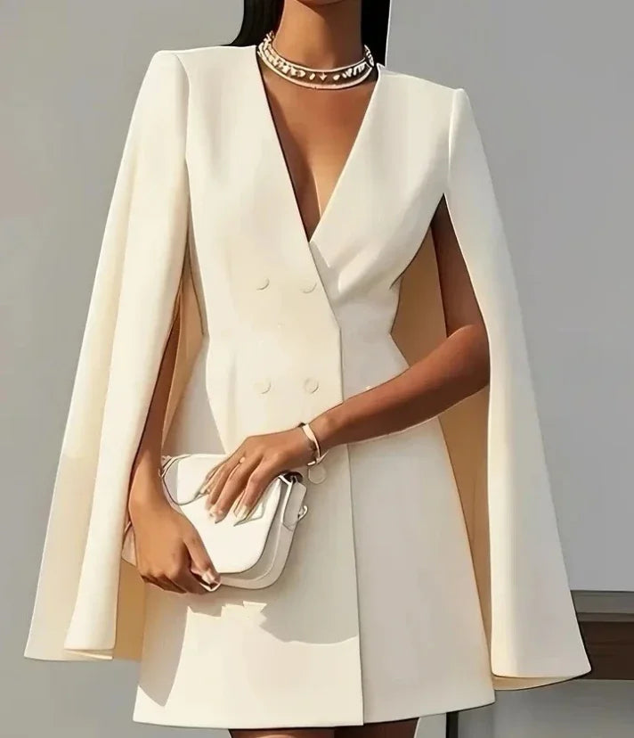 Elegant women's double-breasted mini dress with stylish cape sleeves, perfect for cocktail parties.