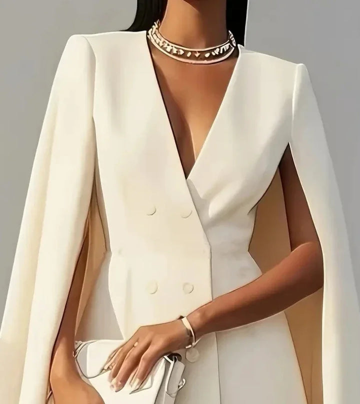 Fashionable double-breasted mini dress for women, featuring elegant cape sleeves, a true statement piece.