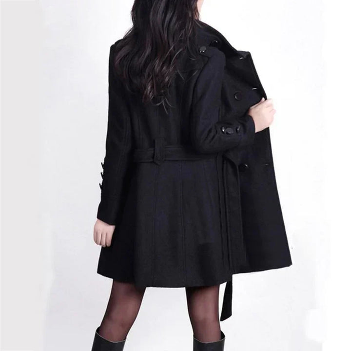 Classic women's fall/winter trench coat featuring double-breasted design & adjustable belted waist for a chic look.