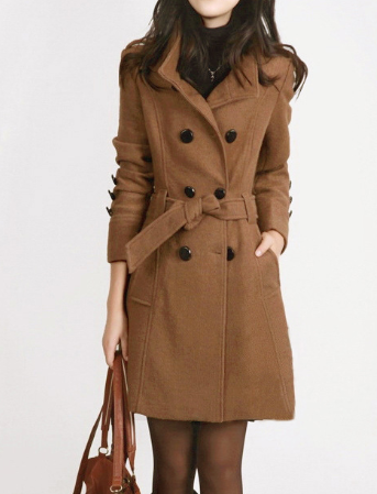 Stylish women's long trench coat with a double-breasted front and belted waist, a versatile and chic outerwear piece.
