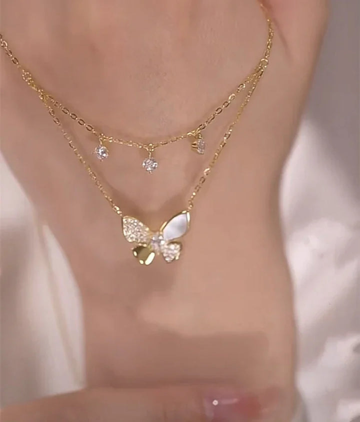 Double-layered women's necklace showcasing a beautiful butterfly design with shimmering zirconia and mother-of-pearl.