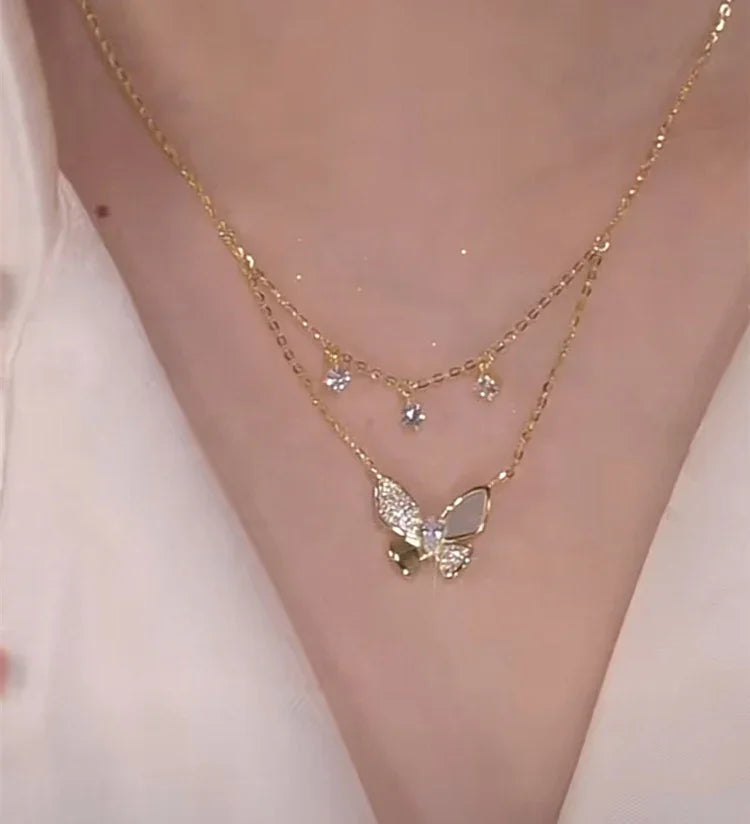 Stunning women's zirconia and mother-of-pearl butterfly necklace. This elegant double-layered jewelry is a lovely gift.
