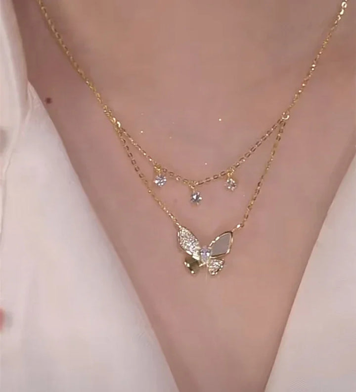 Stunning women's zirconia and mother-of-pearl butterfly necklace. This elegant double-layered jewelry is a lovely gift.