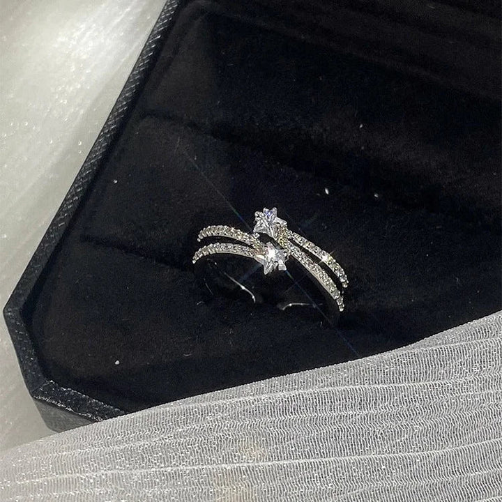 Modern women's double-layered star ring set. Versatile silver rings with delicate celestial designs & zirconia gems.