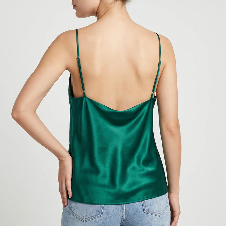 Close-up of a women's elegant camisole top, showcasing the stylish draped cowl neckline.