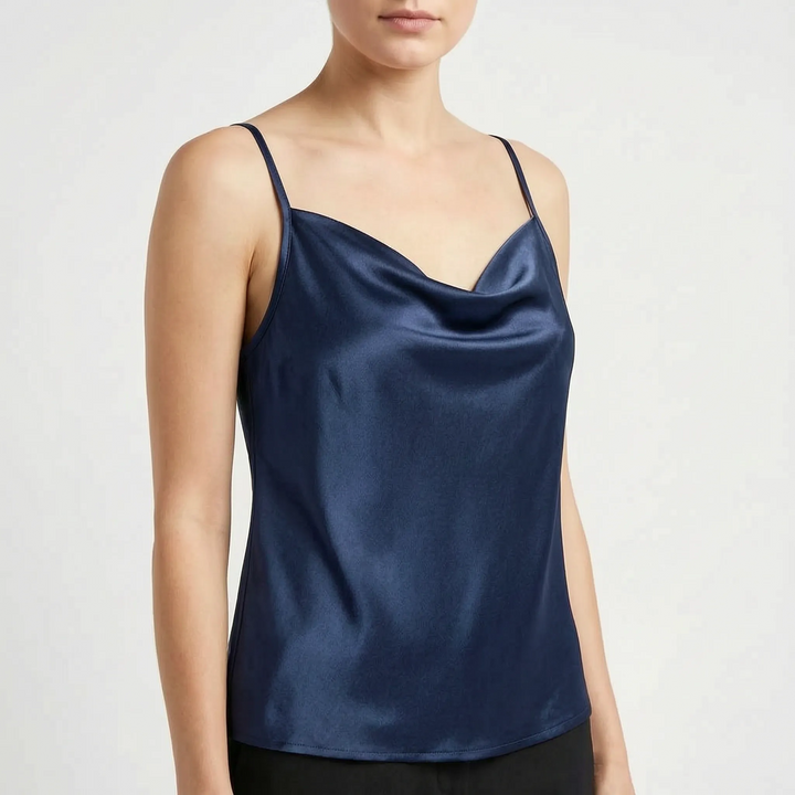 Model wearing an elegant women's draped cowl neck camisole top, styled for chic summer fashion.