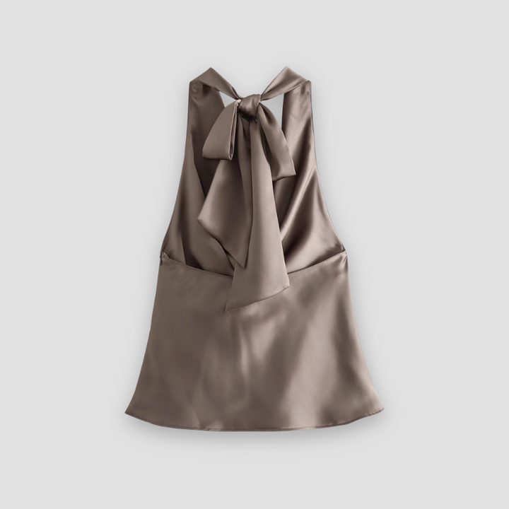 Sleeveless women's elegant satin blouse with a sophisticated draped halter neckline. Great for fashion-forward looks.