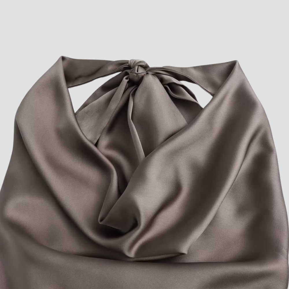 Fashionable women's satin halter tank top, showcasing elegant draping for a chic and modern look. Summer essential.
