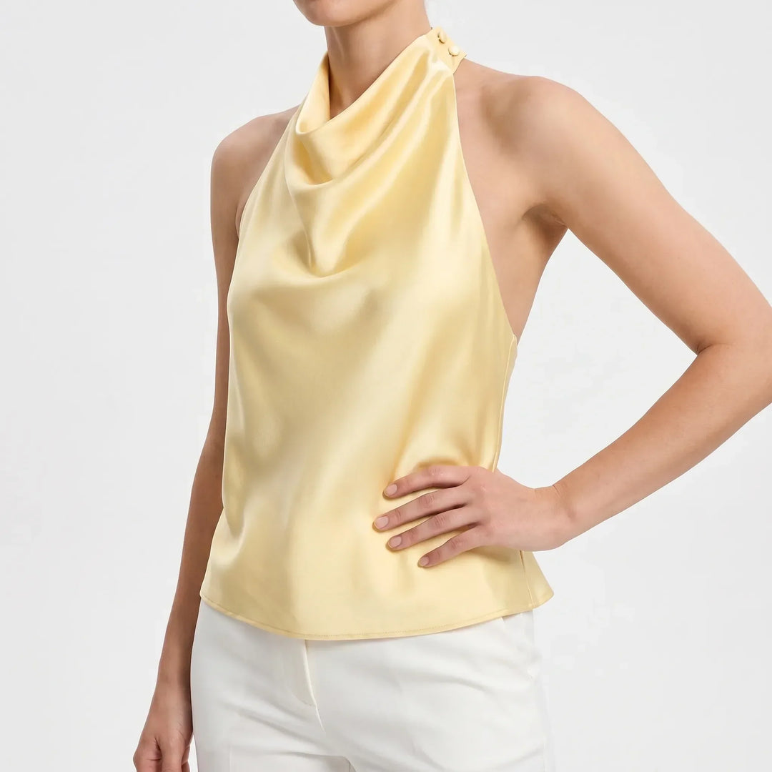 Sophisticated backless party top for women, a solid color draped halter perfect for fashion.