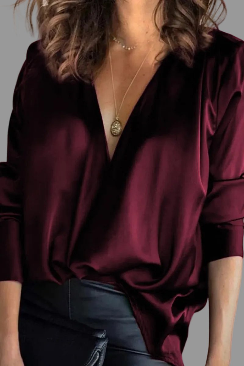 Chic women's long sleeve v-neck blouse with elegant draping, a relaxed fit top for sophisticated party wear.