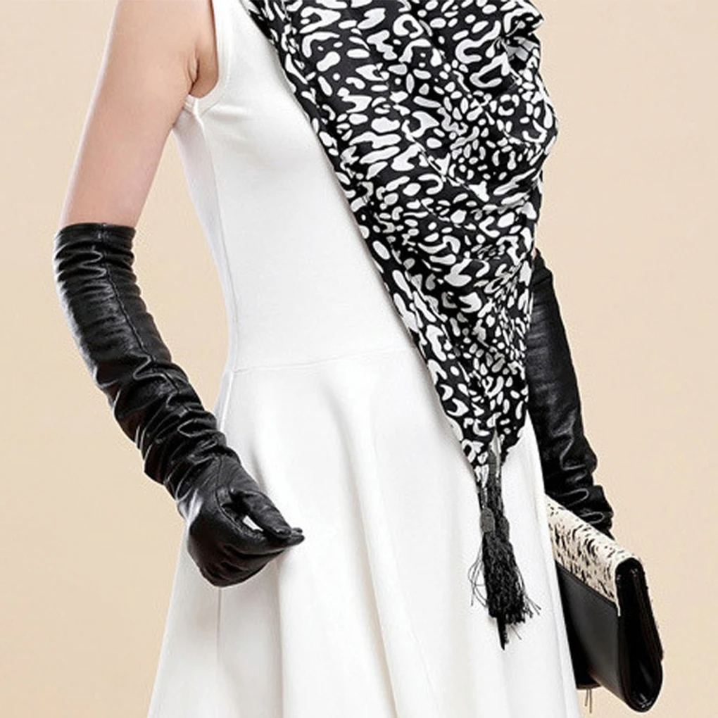Elegant women's elbow-length vegan leather gloves, a chic fashion accessory.