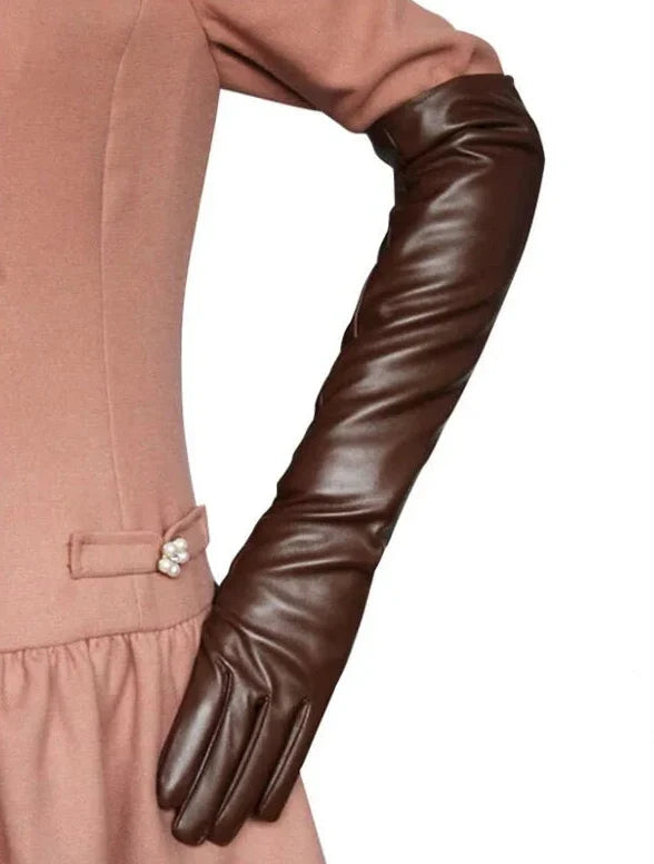 Vibrant red elbow-length vegan leather gloves, a bold women's fashion accessory for special occasions.