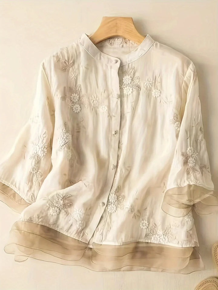 Chic women's floral embroidered shirt, a versatile button-down long sleeve top for elegant spring & fall outfits.
