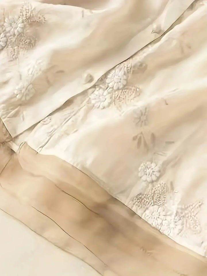Fashionable women's embroidered floral blouse with button closure and long sleeves for versatile styling.
